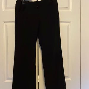 New York & Company black dress pants pockets and short waist. Wide leg at bottom